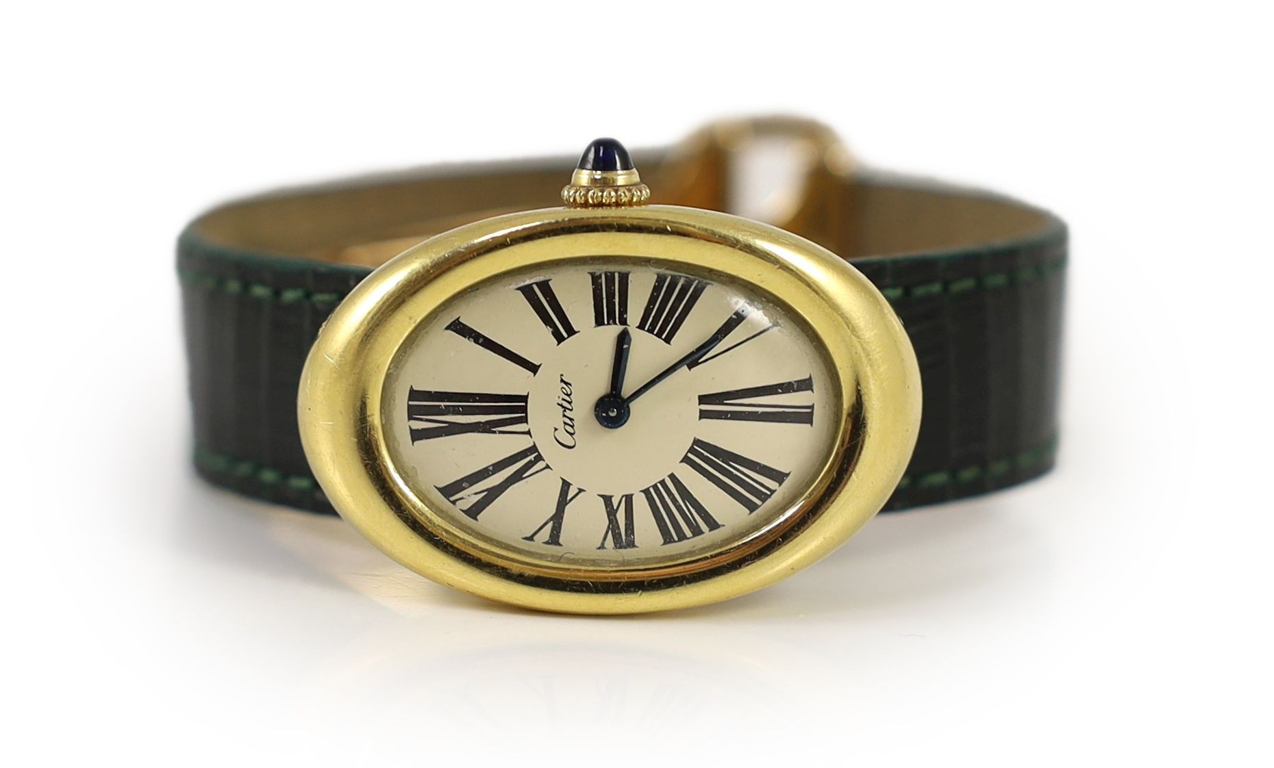 A lady's 18ct gold Cartier Baignoire manual wind oval wrist watch, on a Cartier green leather strap with deployment clasp